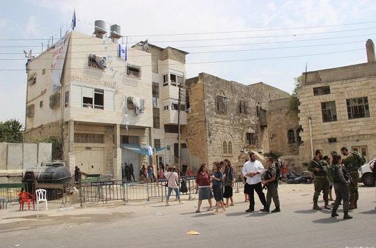 Palestinians protest as settler sets up new outpost in Hebron