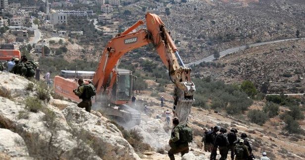 Israeli occupation grabs Palestinian lands to expand illegal outpost