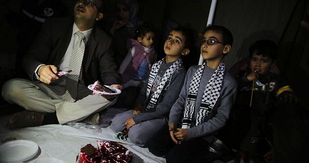 Palestinian child celebrates his birthday at Gaza border