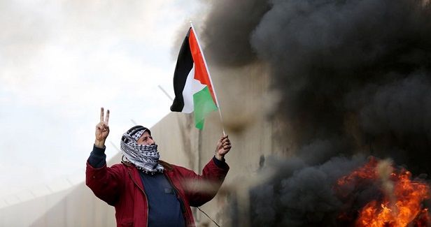 Palestinians in Bilin take to the street in protest at US decision