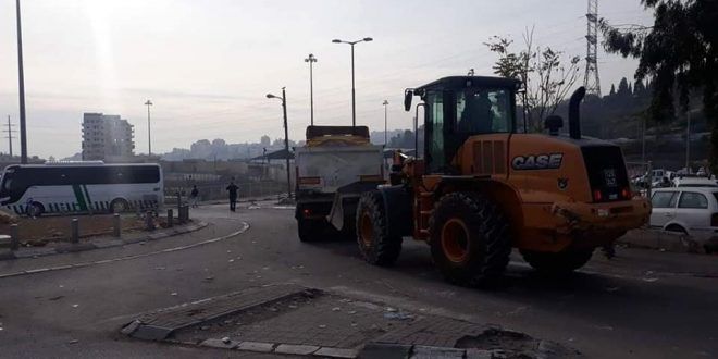 Israeli occupation bulldozers begin to demolish shops and businesses in Shuafat Refugee Camp.