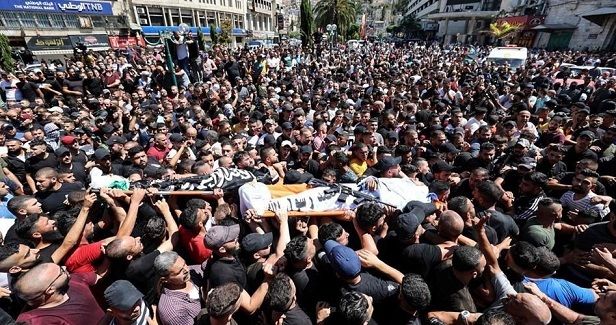 Thousands march in funerals of two Palestinians killed in Nablus