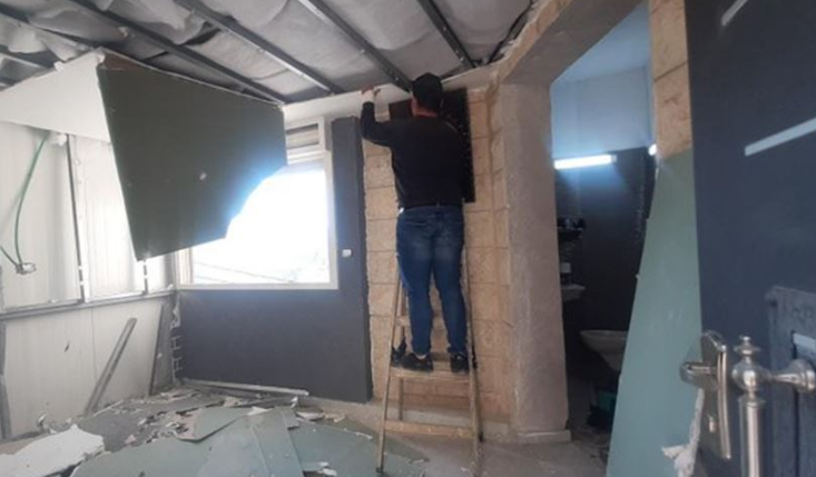 IOA forces Palestinian to raze part of his house