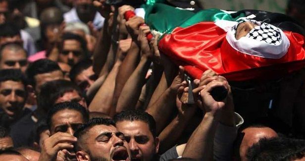 Two slain Palestinians laid to rest in West Bank, Gaza