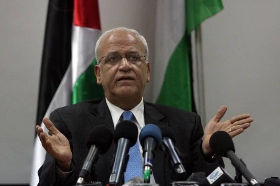 Erekat poses a question to Arab countries attending Bahrain Workshop