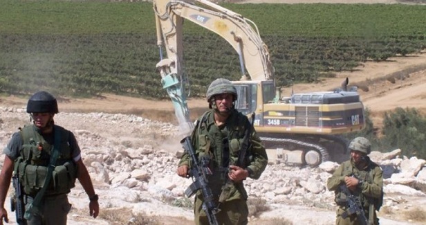 Israeli forces level Palestinian lands in Burin for illegal settlement
