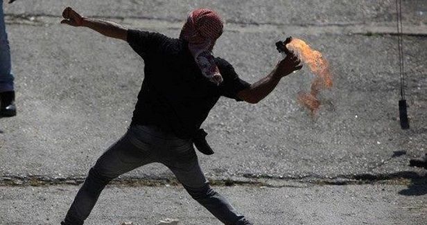 Palestinian youths throw fire bombs at Israeli forces in Azzun town