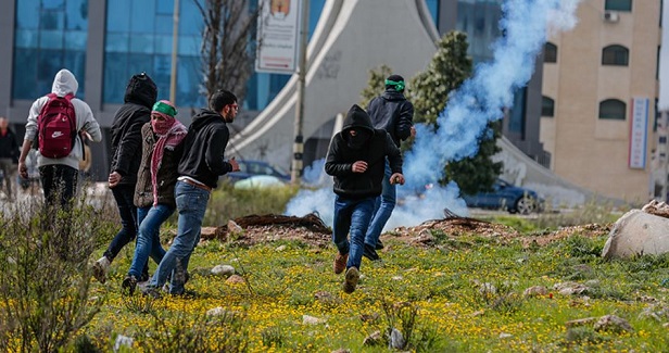 Dozens choke on tear gas in West Bank confrontations