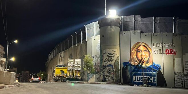 Drawing her picture on the wall: Palestinians demand Biden justice for Shireen Abu Akleh ahead of his visit to Bethlehem