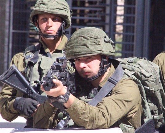 Israeli forces assault journalists, injure youth in Hebron City