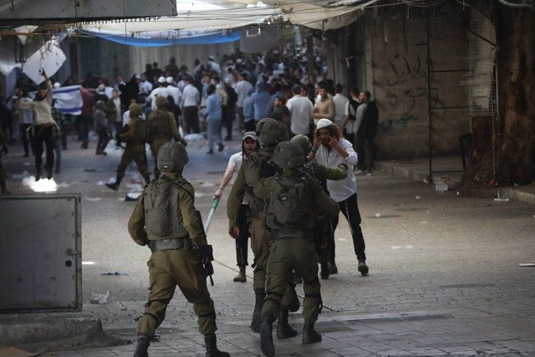 Israel occupation forces, settlers attack Palestinians in Hebron