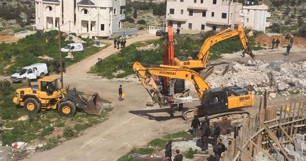 Palestinian forced to demolish his house