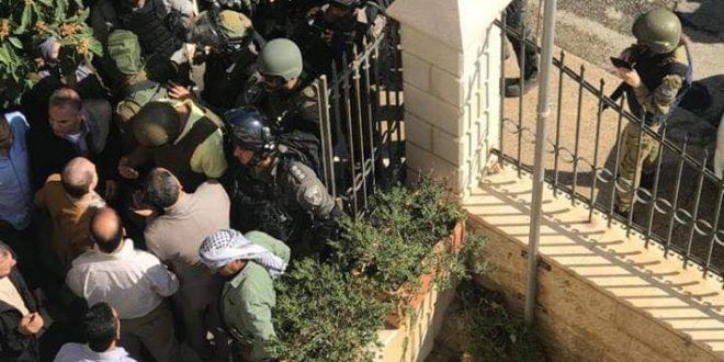 IOF storm Jerusalem governorate, injure two employees