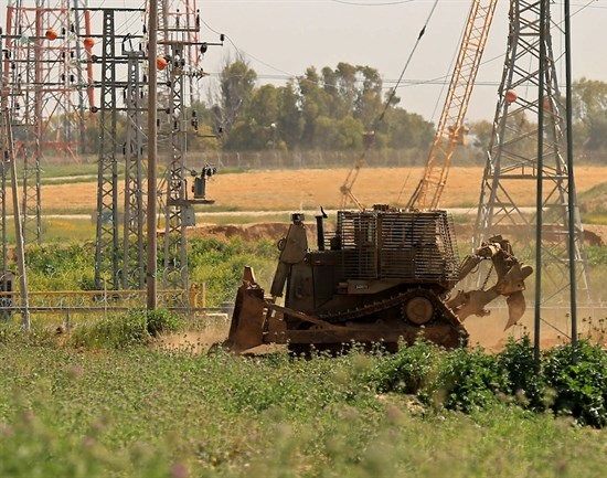 Israeli bulldozers raze, level lands in southern Gaza