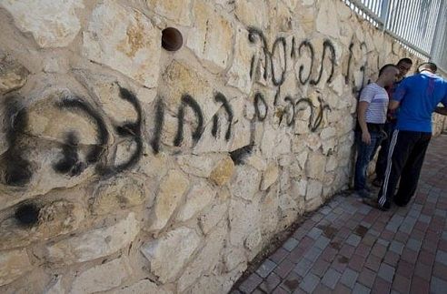 Israeli settlers attack Palestinian homes, spray-paint racist graffiti
