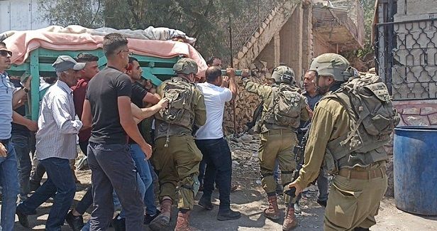 IOF attacks funeral of Palestinian woman in al-Khalil