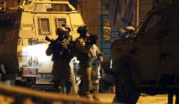 13 Palestinians arrested in IOF pre-dawn raids