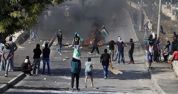 Four Palestinians injured in clashes with IOF in W. Bank