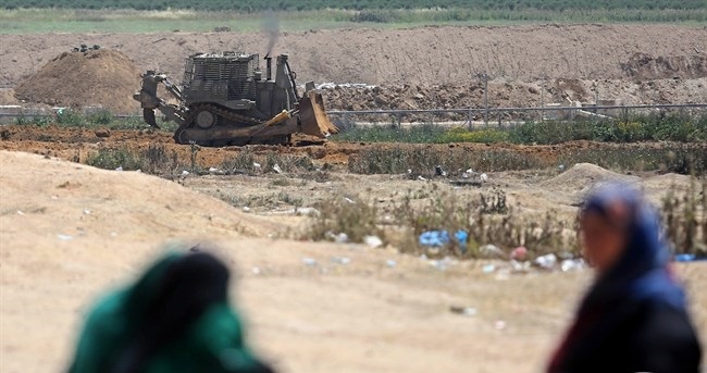 Israeli bulldozers raze lands, navy attacks fishermen in Gaza