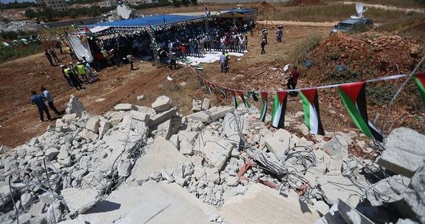 Israel forces Palestinian families to demolish their homes in Qalandi