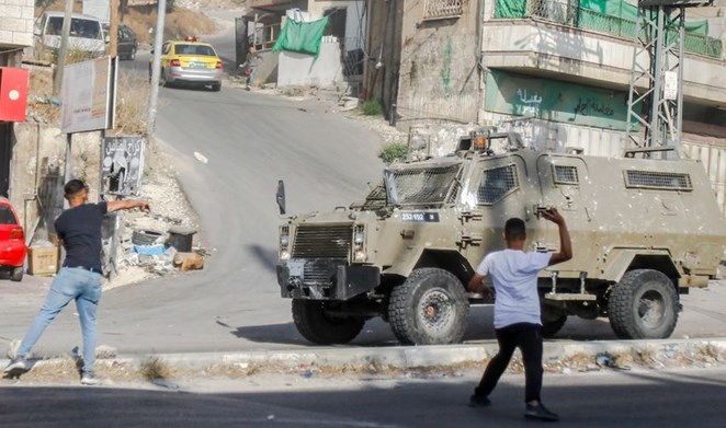 Scores of Palestinians injured during IOF raid south of Nablus