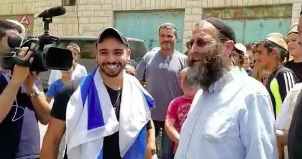 Israeli settlers celebrate return of Palestinian detainees killer