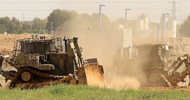 Israeli bulldozers raze, level lands in northern Gaza