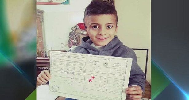 Child Ahmed Dawabsha celebrates school success alone