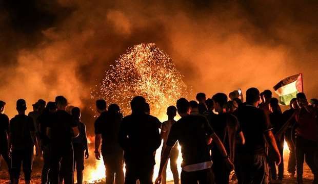 Several Palestinian injuries in IOF shooting at Gaza night protest