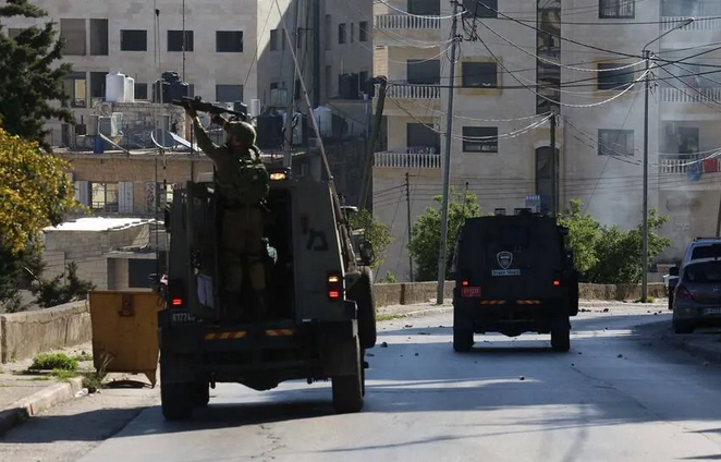 Israeli troops kill Palestinian in West Bank raid, Palestinian official says