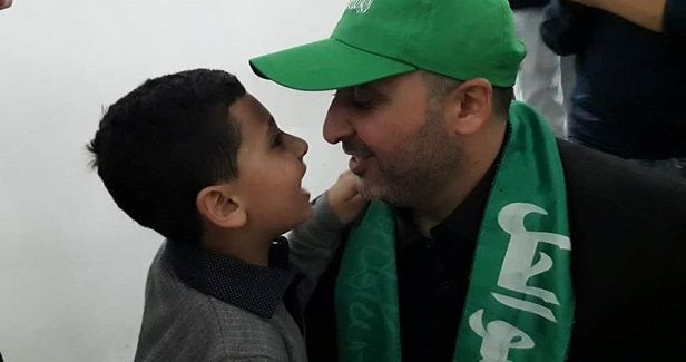 Palestinian prisoner holds his child in his arms for 1st time in years