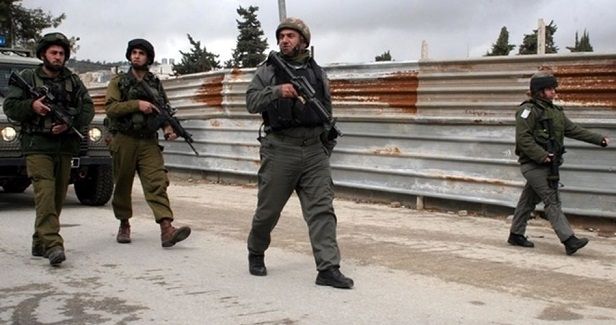 IOF arrests 13 West Bank Palestinians
