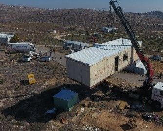 Israeli settlers dismantle own structures illegally set up on Palestinian lands