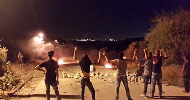 Palestinians suffer from tear gas during clashes with IOF in Jenin