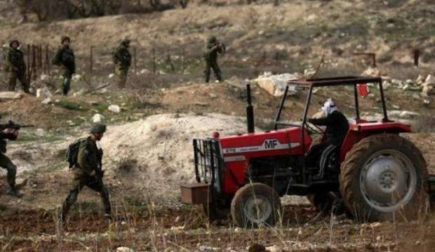 injured, tractor seized by IOF in Jordan Valley