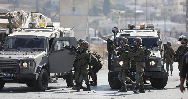 Scores of Palestinians injured in IOF raid on Ramallah village