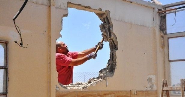 Palestinian forced to self-demolish family house